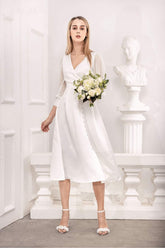 Silk organza midi dress with wrap bodice, sheer sleeves, and side button detail